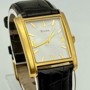 Bulova watch gold tone, 30mm size case, 7.5in size wrist leather band